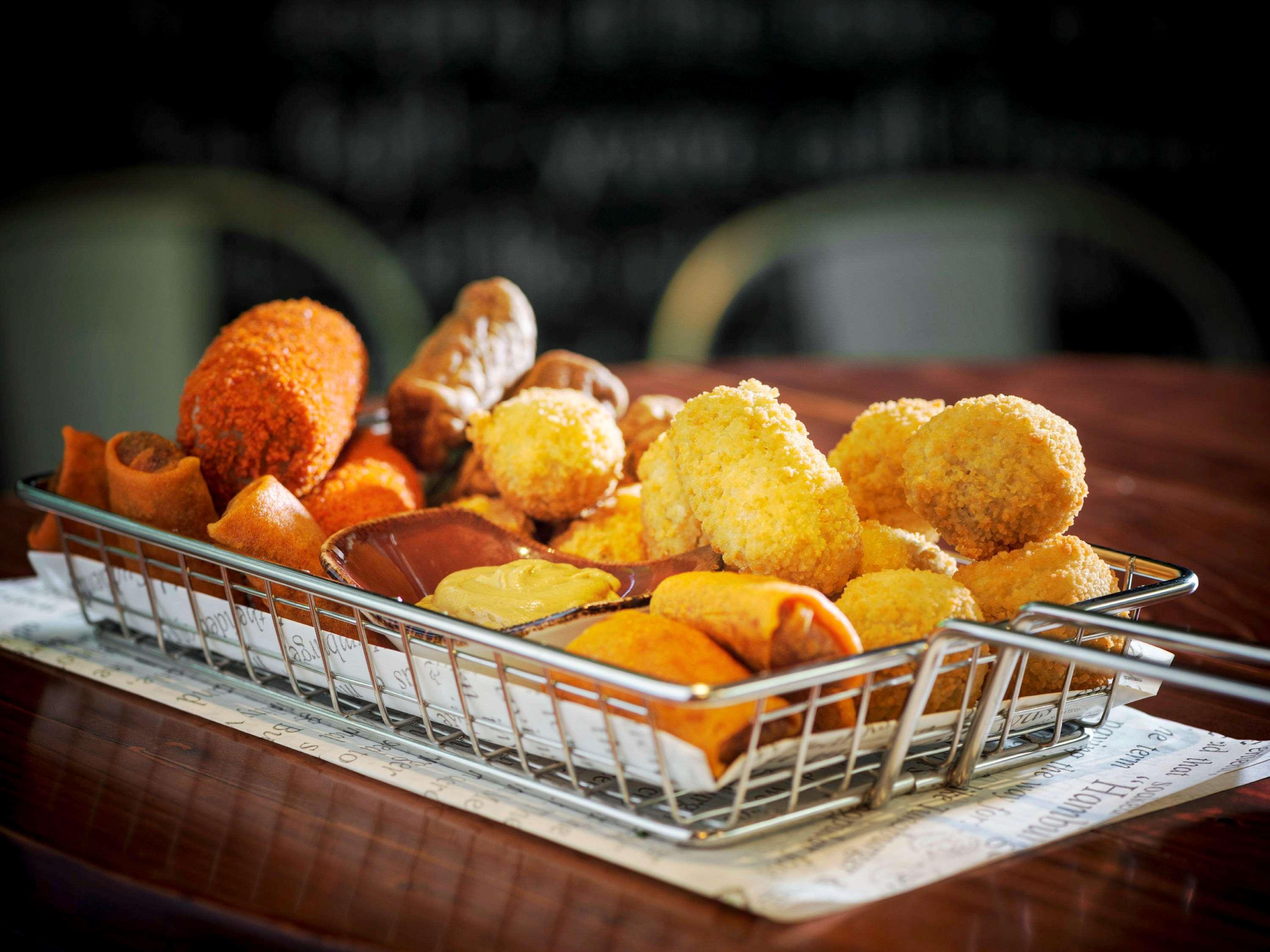 Sofitel Dubai Jumeirah Beach Exterior photo A plate of tapas